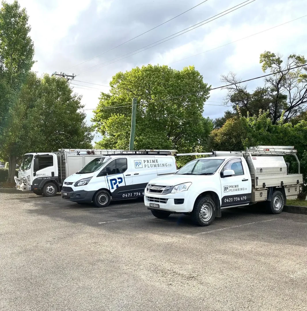 Prime Plumbing Co vehicles parked outdoors.