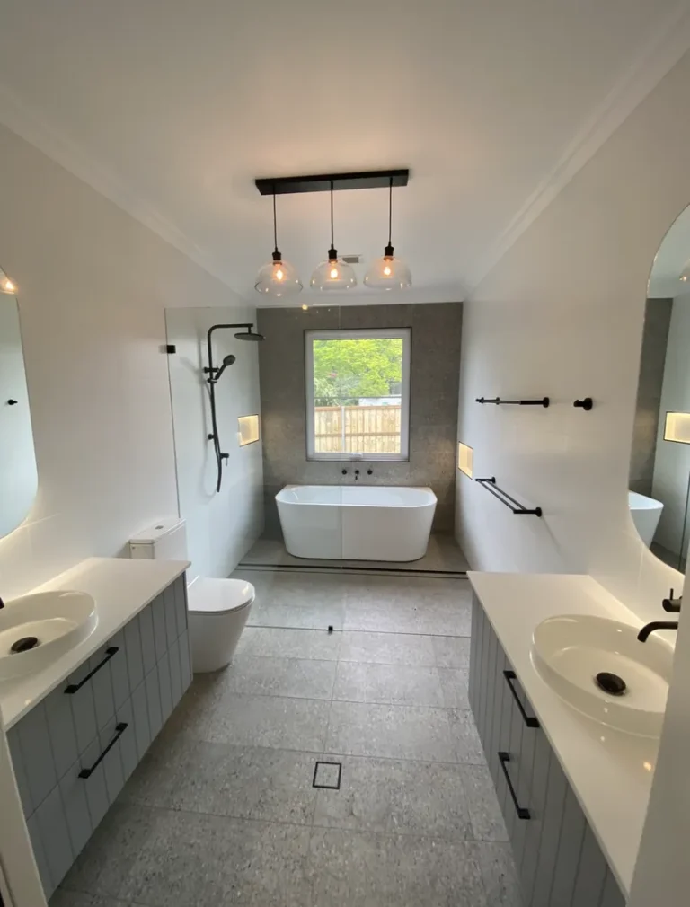Modern bathroom with bathtub and double sinks