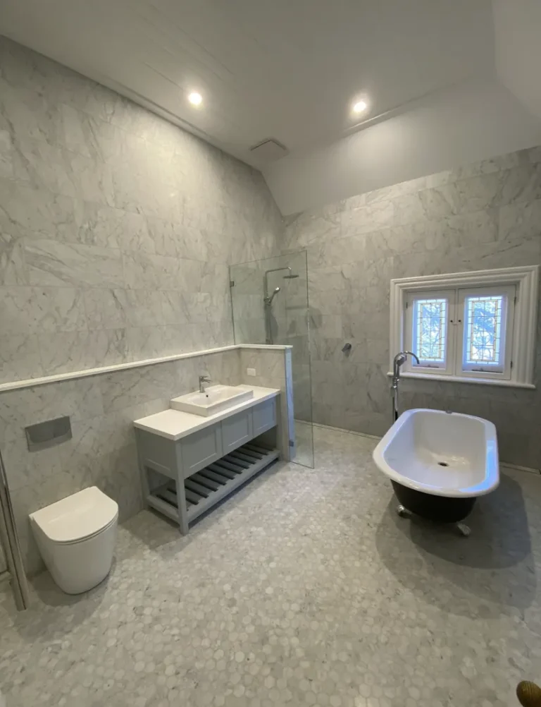 Modern marble bathroom with freestanding bathtub
