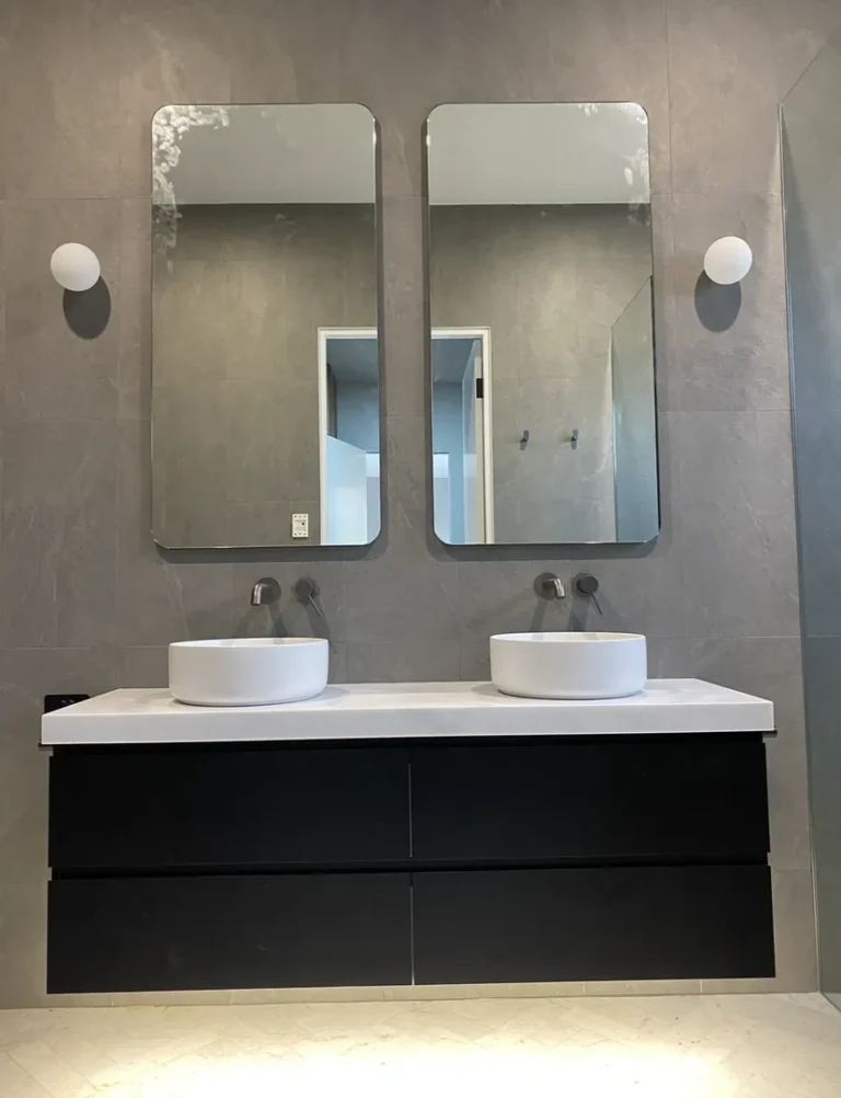 Modern double sink bathroom with mirrors